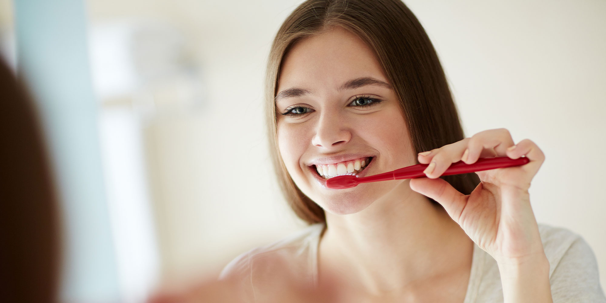 patient brushing teeth